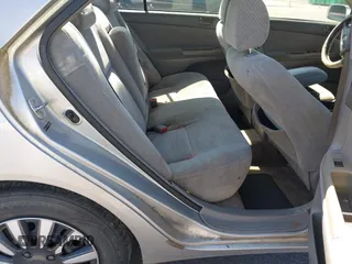 2004 Toyota Camry LE with VIN 4T1BE32K04U319290, listed as a IAAI auction lot 42019125 with 304,666 mi miles. Bid and sale history available at carsss.com. Image 8.