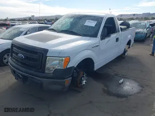 2014 Ford F-150 XL with VIN 1FTMF1CM3EKG36797, listed as a IAAI auction lot 40892574 with 136,417 mi miles. Bid and sale history available at carsss.com. Image 2.