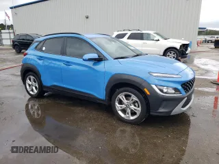 2022 Hyundai Kona SEL with VIN KM8K62AB2NU912837, listed as a Copart auction lot 50878275 with 87,325 mi miles and Salvage Title. Bid and sale history available at DreamBid. Image 4.
