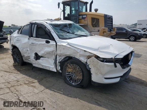2021 Mazda CX-5 Touring with VIN JM3KFACM1M0405129, listed as a Copart auction lot 67874724 with 49,618 mi miles and Salvage Title. Bid and sale history available at carsss.com. Image 4.