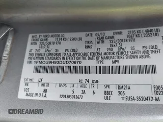 2013 Ford Escape SEL with VIN 1FMCU9H93DUD70670, listed as a IAAI auction lot 41867784 with 207,956 mi miles. Bid and sale history available at carsss.com. Image 9.