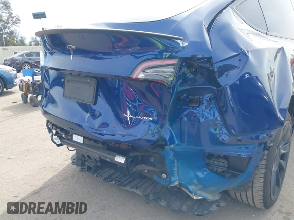2022 Tesla Model Y Long Range with VIN 7SAYGDEE0NA019067, listed as a IAAI auction lot 41645198 with 49,336 mi miles and . Bid and sale history available at DreamBid. Image 6.