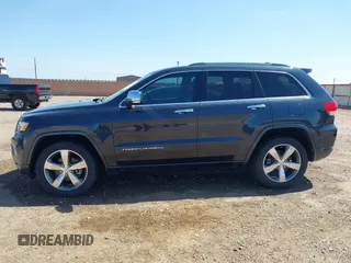 2015 Jeep Grand Cherokee Overland with VIN 1C4RJECG3FC635327, listed as a IAAI auction lot 41910559 with 118,519 mi miles and . Bid and sale history available at DreamBid. Image 14.