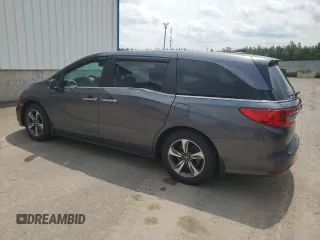 2018 Honda Odyssey with VIN 5FNRL6H49JB504977, listed as a Copart auction lot 60905615 with 180,464 mi miles and Clean title. Bid and sale history available at DreamBid. Image 2.