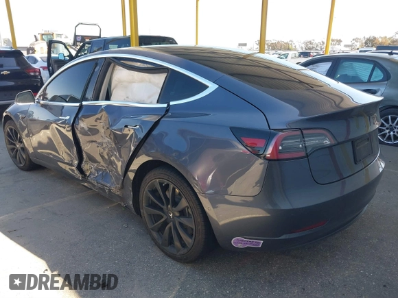 2018 Tesla Model 3 Long Range Battery with VIN 5YJ3E1EA7JF163401, listed as a IAAI auction lot 41829681 with 90,065 mi miles. Bid and sale history available at carsss.com. Image 3.