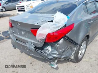 2015 Kia Optima LX with VIN 5XXGM4A71FG423232, listed as a IAAI auction lot 42054131 with 135,213 mi miles. Bid and sale history available at carsss.com. Image 6.