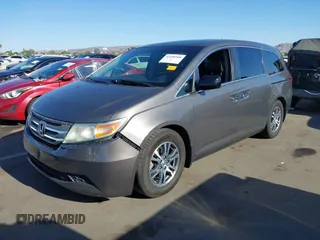 2011 Honda Odyssey EX-L with VIN 5FNRL5H6XBB083980, listed as a IAAI auction lot 42100308 with 191,361 mi miles and . Bid and sale history available at carsss.com. Image 2.