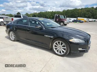 2018 Jaguar XJ with VIN SAJWA1C76J8W14271, listed as a Copart auction lot 73777914 with 124,155 mi miles and Salvage Title. Bid and sale history available at carsss.com. Image 4.