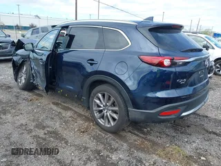 2021 Mazda CX-9 Grand Touring with VIN JM3TCBDY3M0537975, listed as a IAAI auction lot 42251894 with 50,156 mi miles and . Bid and sale history available at DreamBid. Image 3.
