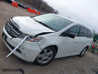 2013 Honda Odyssey Touring with VIN 5FNRL5H96DB089336, listed as a IAAI auction lot 41527990 with 128,770 mi miles. Bid and sale history available at carsss.com. Image 14.