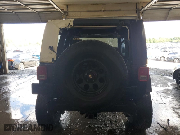 2009 Jeep Wrangler Sahara with VIN 1J4FA54159L772622, listed as a Copart auction lot 55648305 with 141,880 mi miles and Salvage title. Bid and sale history available at DreamBid. Image 6.