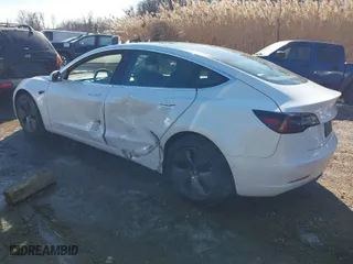 2020 Tesla Model 3 Standard Range Plus with VIN 5YJ3E1EA3LF706861, listed as a IAAI auction lot 41400754 with 85,231 mi miles. Bid and sale history available at carsss.com. Image 3.