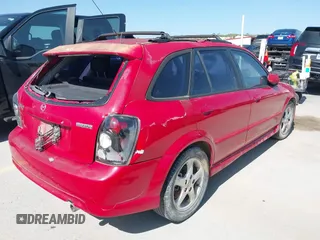 2002 Mazda Protege with VIN JM1BJ246721565634, listed as a IAAI auction lot 41984727 with 235,764 mi miles and . Bid and sale history available at DreamBid. Image 4.