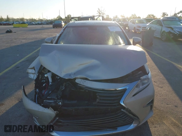 2016 Lexus ES 300h z VIN JTHBW1GG4G2106710, wystawiony jako IAAI lot #41684479 z przebiegiem 144 559 mil mil oraz . Historia ofert i sprzedaży dostępna na DreamBid. Obrazek 13.