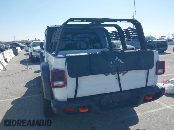 2022 Jeep Gladiator Mojave z VIN 1C6JJTEG0NL103523, wystawiony jako IAAI lot #41842011 z przebiegiem 36 160 mil mil oraz . Historia ofert i sprzedaży dostępna na DreamBid. Obrazek 3.