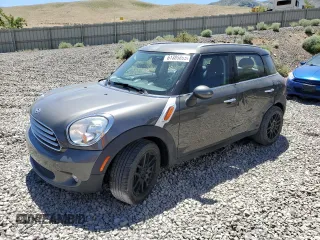 2014 MINI Countryman with VIN WMWZB3C56EWR38919, listed as a Copart auction lot 61385865 with 127,368 mi miles and Salvage title. Bid and sale history available at DreamBid. Image 1.
