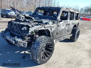 2022 Jeep Wrangler 4xe Unlimited Sahara with VIN 1C4JJXP66NW233812, listed as a IAAI auction lot 41325503 with 1 mi miles. Bid and sale history available at carsss.com. Image 2.
