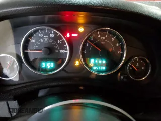 2012 Jeep Wrangler Sport with VIN 1C4AJWAG5CL233049, listed as a Copart auction lot 52328865 with 185,388 mi miles and Salvage title. Bid and sale history available at DreamBid. Image 9.