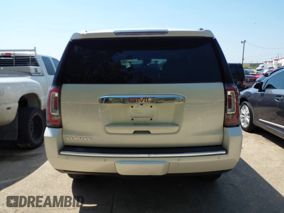 2015 GMC Yukon Denali with VIN 1GKS1CKJ8FR575730, listed as a IAAI auction lot 42048050 with 113,077 mi miles. Bid and sale history available at carsss.com. Image 17.