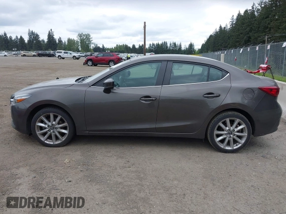 2017 Mazda 3 Touring with VIN 3MZBN1V73HM118104, listed as a IAAI auction lot 42139361 with 71,615 mi miles and . Bid and sale history available at DreamBid. Image 13.