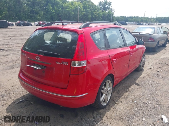 2010 Hyundai Elantra Touring SE with VIN KMHDC8AE2AU075841, listed as a IAAI auction lot 40128211 with 173,541 mi miles. Bid and sale history available at carsss.com. Image 4.