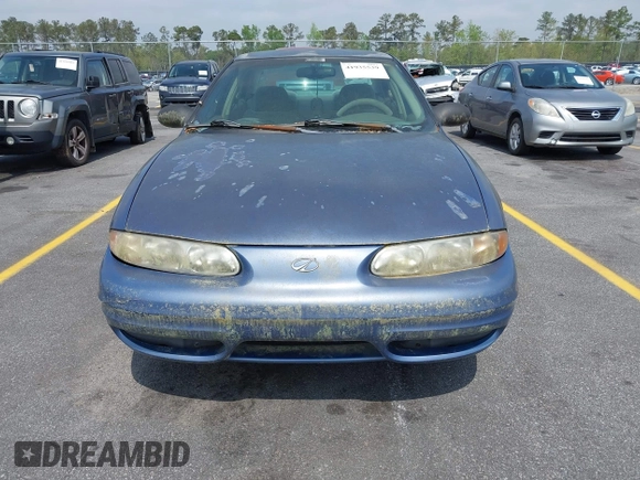 1999 Oldsmobile Alero GL z VIN 1G3NL52TXXC339892, wystawiony jako IAAI lot #41935539 z przebiegiem 315 555 mil mil oraz . Historia ofert i sprzedaży dostępna na DreamBid. Obrazek 6.