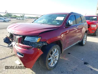 2015 Jeep Grand Cherokee Summit with VIN 1C4RJEJG9FC100568, listed as a IAAI auction lot 42512705 with 128,413 mi miles and . Bid and sale history available at DreamBid. Image 2.