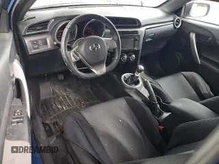 2014 Scion tC z VIN JTKJF5C76E3087992, wystawiony jako Copart lot #56058445 z przebiegiem 84 387 mil mil oraz Czysty tytuł • Clean title. Historia ofert i sprzedaży dostępna na DreamBid. Obrazek 8.