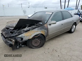 2001 Toyota Camry CE z VIN JT2BG22K210569974, wystawiony jako Copart lot #53665465 z przebiegiem Nie podano mil oraz Nie do naprawy • Non repairable. Historia ofert i sprzedaży dostępna na DreamBid. Obrazek 1.