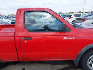 2000 Nissan Frontier XE z VIN 1N6DD21SXYC366427, wystawiony jako IAAI lot #42111404 z przebiegiem 176 579 mil mil oraz . Historia ofert i sprzedaży dostępna na DreamBid. Obrazek 14.