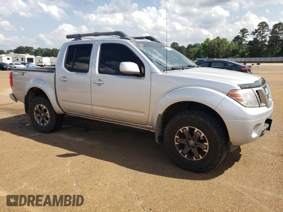 2016 Nissan Frontier Pro-4X with VIN 1N6AD0EV0GN797437, listed as a Copart auction lot 54203245 with 131,021 mi miles and Salvage title. Bid and sale history available at DreamBid. Image 4.