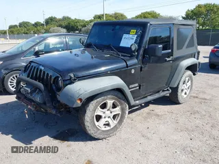 2016 Jeep Wrangler Willys Wheeler z VIN 1C4AJWAG9GL257621, wystawiony jako IAAI lot #41432306 z przebiegiem 84 248 mil mil oraz . Historia ofert i sprzedaży dostępna na DreamBid. Obrazek 2.