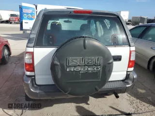 2001 Isuzu Rodeo z VIN 4S2CK57W614340766, wystawiony jako Copart lot #73891524 z przebiegiem 124 446 mil mil oraz Nie do naprawy. Historia ofert i sprzedaży dostępna na DreamBid. Obrazek 6.