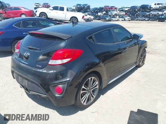 2016 Hyundai Veloster Turbo with VIN KMHTC6AE5GU281597, listed as a IAAI auction lot 42006038 with 77,642 mi miles. Bid and sale history available at carsss.com. Image 4.