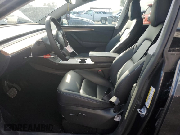 2024 Tesla Model Y Long Range with VIN 7SAYGDEE2RA252101, listed as a Copart auction lot 49514675 with 19,399 mi miles and Salvage Title. Bid and sale history available at DreamBid. Image 7.