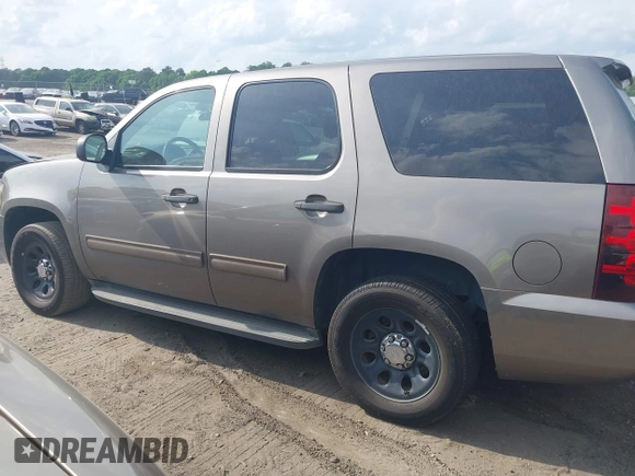 2012 Chevrolet Tahoe Commercial with VIN 1GNLC2E07CR187432, listed as a IAAI auction lot 42126539 with 169,607 mi miles and . Bid and sale history available at DreamBid. Image 14.