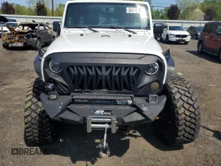 2013 Jeep Wrangler Unlimited Rubicon with VIN 1C4HJWFG2DL549064, listed as a Copart auction lot 56474055 with 148,217 mi miles and Salvage title. Bid and sale history available at DreamBid. Image 5.