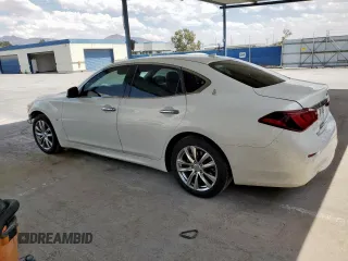 2015 Infiniti Q70 z VIN JN1BY1AP9FM541605, wystawiony jako Copart lot #59394525 z przebiegiem 164 327 mil mil oraz Szkoda całkowita • Salvage title. Historia ofert i sprzedaży dostępna na DreamBid. Obrazek 2.