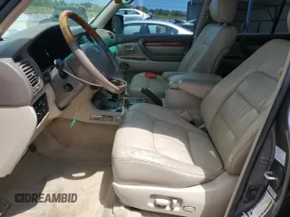 2004 Lexus LX 470 z VIN JTJHT00W743541854, wystawiony jako Copart lot #58053475 z przebiegiem 311 296 mil mil oraz Tytuł czysty. Historia ofert i sprzedaży dostępna na DreamBid. Obrazek 7.