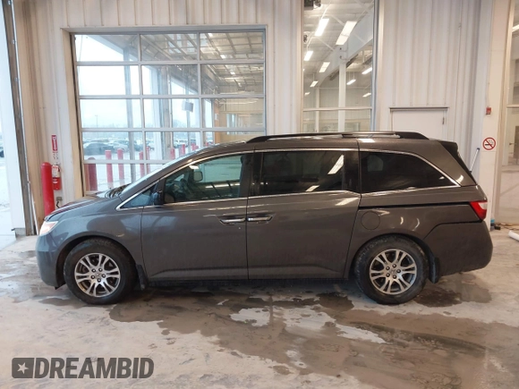 2012 Honda Odyssey EX-L with VIN 5FNRL5H66CB127507, listed as a IAAI auction lot 41961465 with 228,972 mi miles and . Bid and sale history available at carsss.com. Image 14.