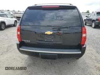 2014 Chevrolet Tahoe LTZ with VIN 1GNSKCE0XER228028, listed as a Copart auction lot 56971135 with 155,285 mi miles and Salvage title. Bid and sale history available at DreamBid. Image 6.