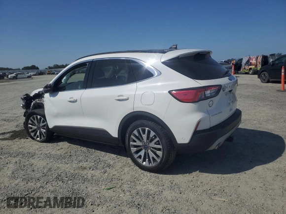 2020 Ford Escape Titanium Hybrid z VIN 1FMCU9DZ6LUC47658, wystawiony jako Copart lot #59599995 z przebiegiem 63 004 mil mil oraz Szkoda całkowita • Salvage title. Historia ofert i sprzedaży dostępna na DreamBid. Obrazek 2.