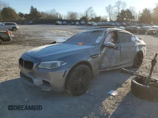 2014 BMW M5 with VIN WBSFV9C57ED593159, listed as a Copart auction lot 87475634 with 0 mi miles and Salvage Title. Bid and sale history available at carsss.com. Image 1.