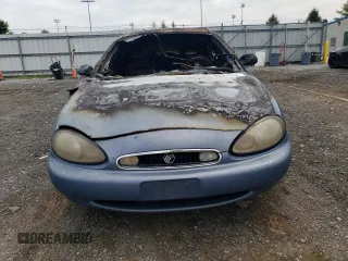1999 Mercury Sable LS z VIN 1MEFM53S4XG649132, wystawiony jako Copart lot #70168934 z przebiegiem Nie podano mil oraz Nie do naprawy. Historia ofert i sprzedaży dostępna na DreamBid. Obrazek 5.