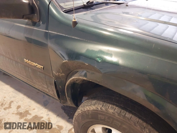 2000 Honda Passport LX z VIN 4S6DM58W1Y4406601, wystawiony jako IAAI lot #41632864 z przebiegiem 195 791 mil mil oraz . Historia ofert i sprzedaży dostępna na DreamBid. Obrazek 6.