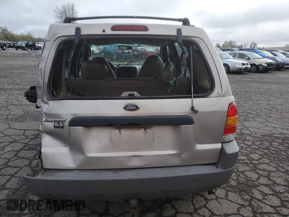 2001 Ford Escape XLS with VIN 1FMYU02111KA37010, listed as a Copart auction lot 52328415 with 312,425 mi miles and Salvage title. Bid and sale history available at DreamBid. Image 6.
