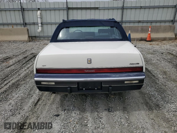1987 Oldsmobile Toronado with VIN 1G3EZ1130HU307201, listed as a Copart auction lot 49290815 with 104,837 mi miles and Salvage Title. Bid and sale history available at DreamBid. Image 6.