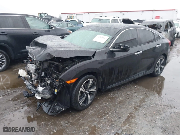 2017 Honda Civic Sedan Touring with VIN 2HGFC1F99HH658034, listed as a IAAI auction lot 41563627 with 140,819 mi miles. Bid and sale history available at carsss.com. Image 17.
