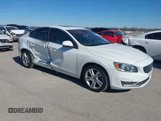 2015 Volvo S60 T5 Drive-E Premier with VIN YV140MFKXF1351769, listed as a IAAI auction lot 41392860 with 56,920 mi miles. Bid and sale history available at carsss.com. Image 1.