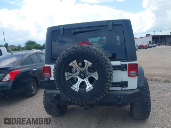 2011 Jeep Wrangler Unlimited Rubicon with VIN 1J4BA6H10BL536027, listed as a IAAI auction lot 42567901 with 164,487 mi miles and . Bid and sale history available at DreamBid. Image 16.